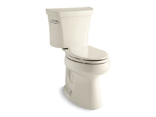 Load image into Gallery viewer, KOHLER 3999-T-47 Highline Comfort Height Two-Piece Elongated 1.28 Gpf Chair Height Toilet With Tank Cover Locks in Almond
